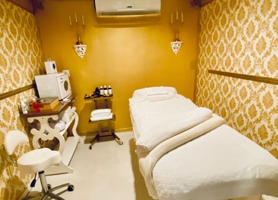 Luxurious treatment room at Spa Maluge in Hoboken, New Jersey, US with plush massage table and elegant decor.