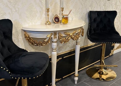 Luxurious black chairs and ornate table at Spa Maluge, Hoboken, New Jersey, US.