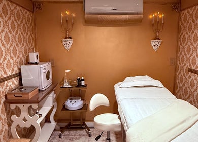 Cozy spa treatment room at Spa Maluge, Hoboken, New Jersey, US with elegant decor and massage bed.