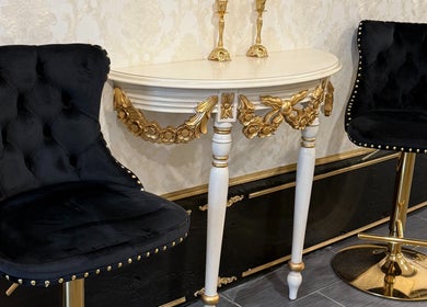 Elegant black chairs and ornate table at Spa Maluge, Hoboken, New Jersey, US.