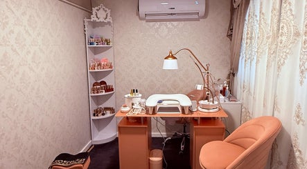 Elegant nail station at Spa Maluge, Hoboken, New Jersey, US. Cozy seating with essential beauty tools.