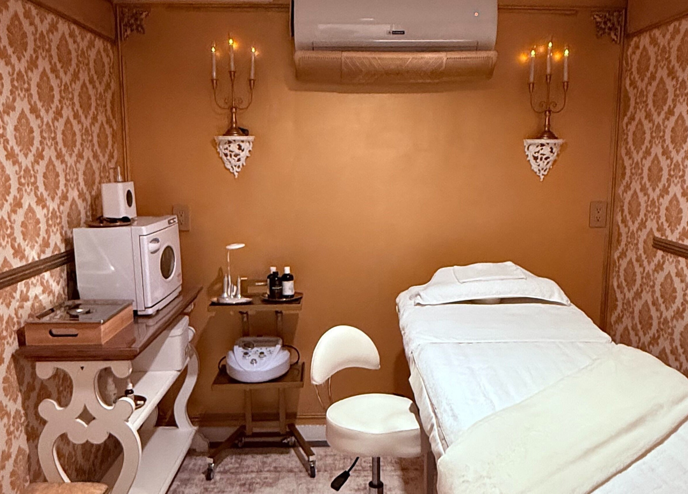 Luxurious treatment room at Spa Maluge in Hoboken, New Jersey, US, featuring ornate decor and massage table.