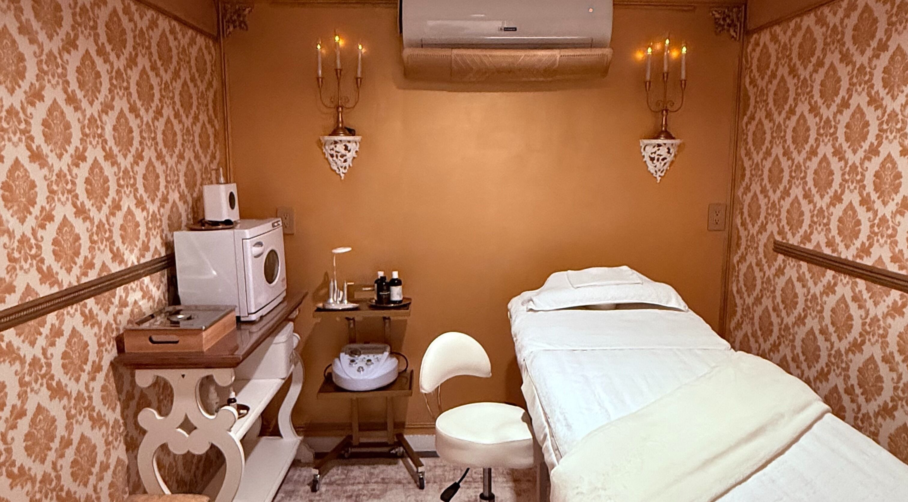 Luxurious treatment room at Spa Maluge in Hoboken, New Jersey, US, featuring ornate decor and massage table.