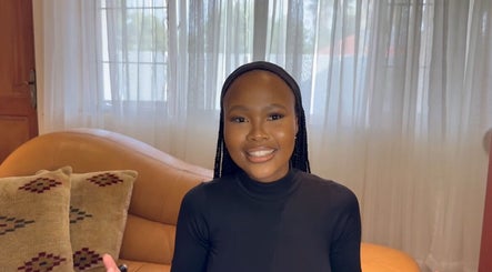 Modern lounge area at Blushery&Co in Gauteng, Gauteng, ZA, featuring cozy couch and elegant decor.