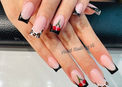 Elegant nail art with animal print and cherries at Violet Nails Salon By Vi At Allertons Leeds, Leeds, England, GB.