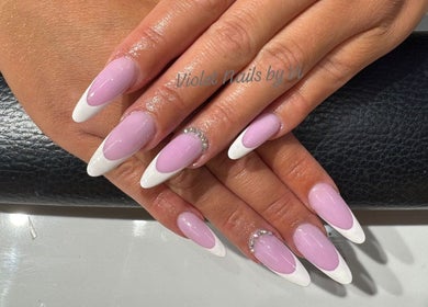 Stylish pink and white manicure at Violet Nails Salon By Vi At Allertons Leeds, Leeds, England, GB.