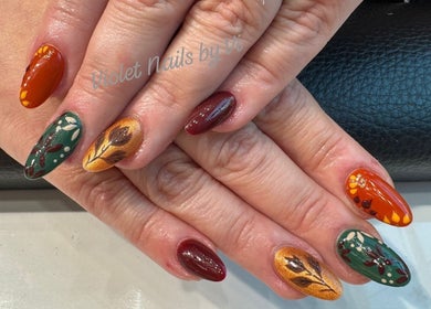 Elegant autumn-themed nail art at Violet Nails Salon By Vi At Allertons Leeds, Leeds, England, GB.
