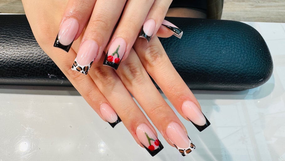 Elegant nail design at Violet Nails Salon By Vi At Allertons Leeds in Leeds, England, GB with black and red accents.
