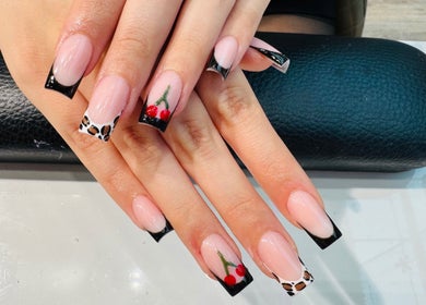 Elegant nail design at Violet Nails Salon By Vi At Allertons Leeds in Leeds, England, GB with black and red accents.