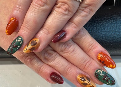 Stylish autumn leaf nail art at Violet Nails Salon By Vi At Allertons Leeds, Leeds, England, GB.