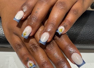 Elegant nail art with blue tips and star accents at Violet Nails Salon By Vi At Allertons Leeds, Leeds, England, GB.
