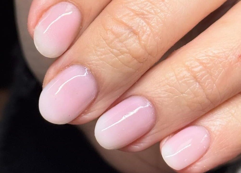 Close-up of manicured nails at Madison - Beauty Studio, Poole, England, GB. Soft pink finish.