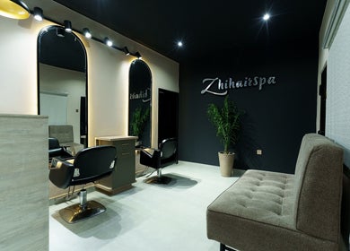 Modern salon interior at Zhihairspa, Port Harcourt, Rivers, NG with sleek chairs and stylish mirrors.