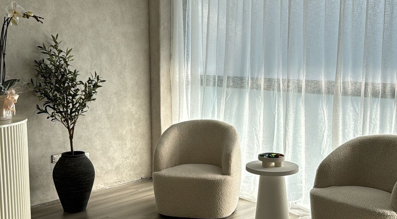 Cozy seating area at Beauty Artistry, Rosebery, New South Wales, AU with natural light and elegant decor.