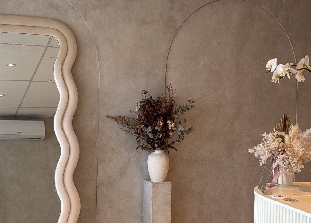 Stylish mirror and floral decor at Beauty Artistry, Rosebery, New South Wales, AU.