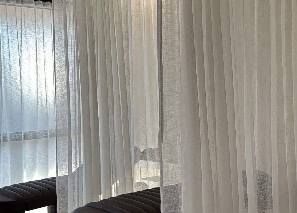 Relaxing treatment area with soft curtains at Beauty Artistry, Rosebery, New South Wales, AU.
