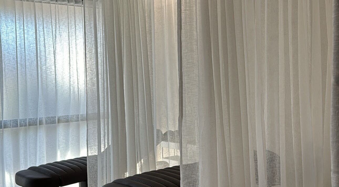Relaxing treatment area with soft curtains at Beauty Artistry, Rosebery, New South Wales, AU.