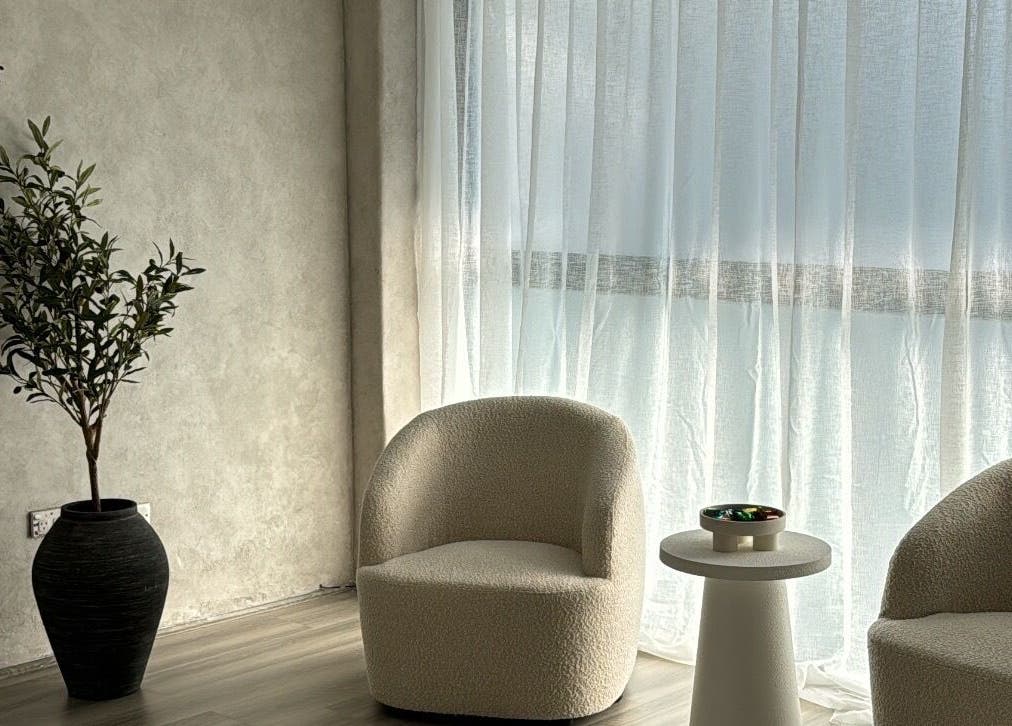 Elegant waiting area at Beauty Artistry, Rosebery, New South Wales, AU featuring chic chairs and natural light.
