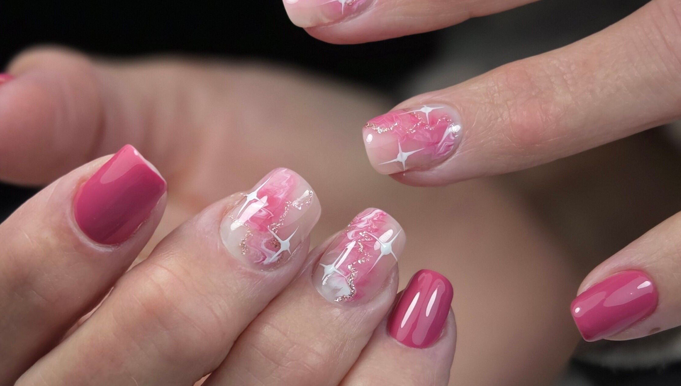 Glossy pink and white star nail art at Gloss & Glitter, Petworth, England, GB.