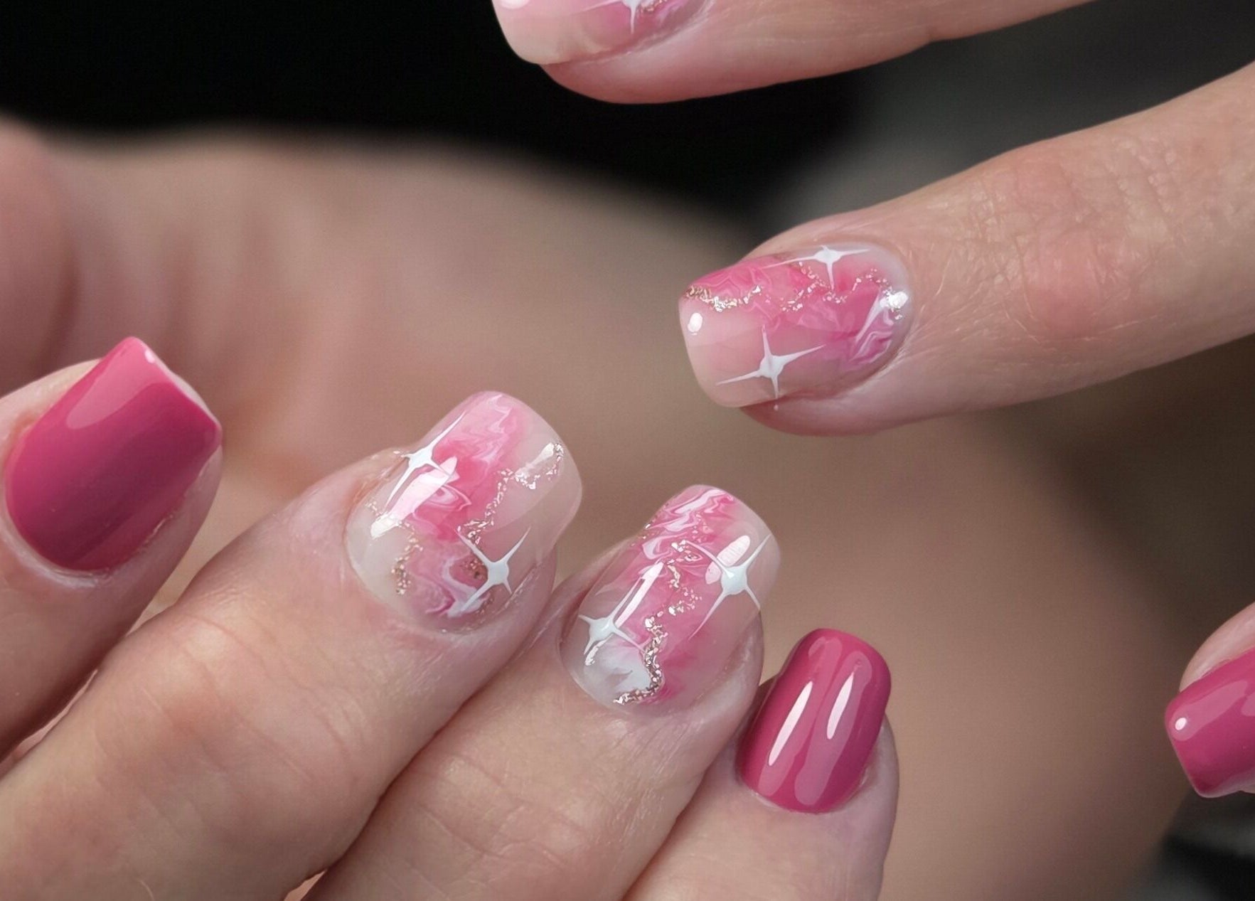 Glossy pink and white star nail art at Gloss & Glitter, Petworth, England, GB.