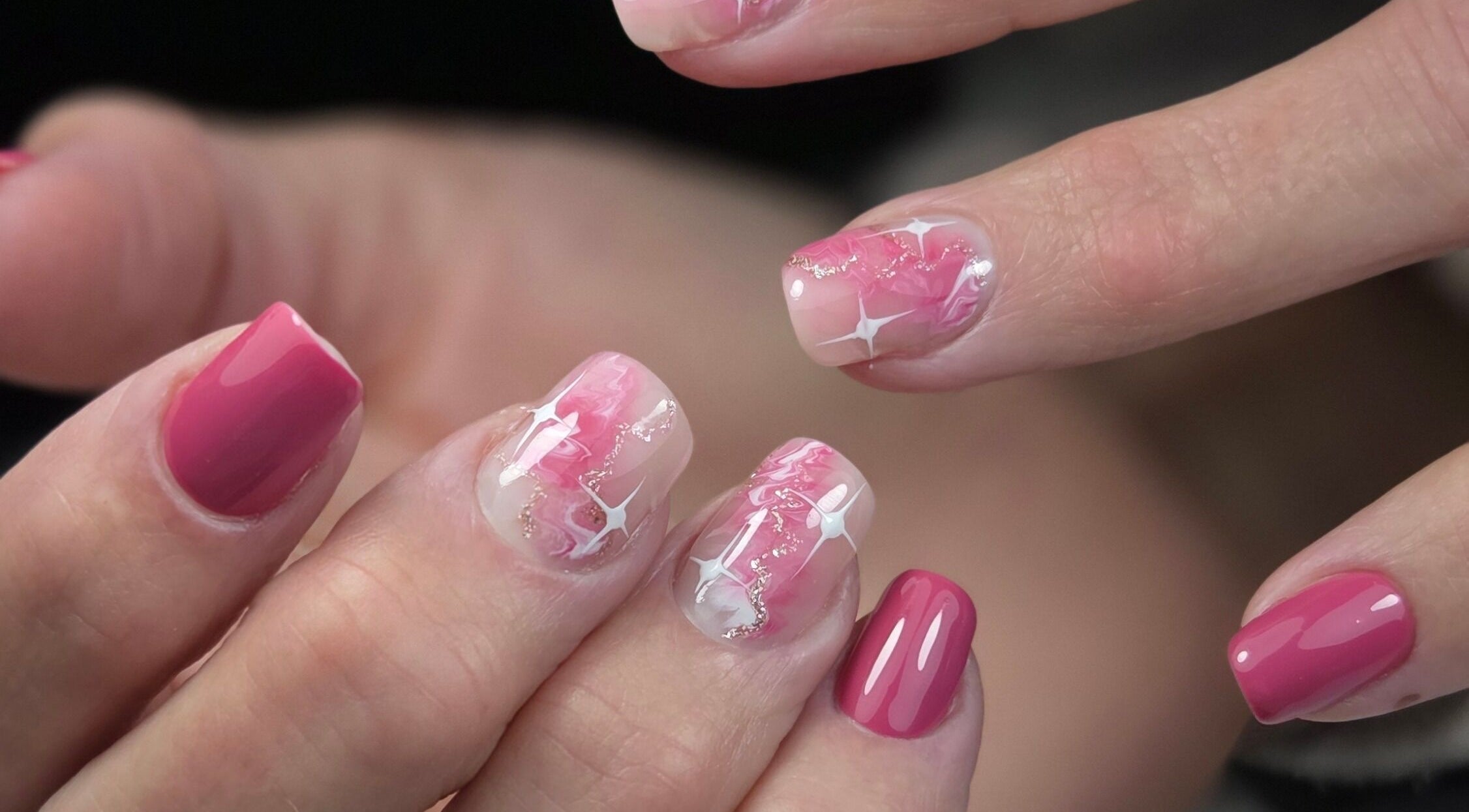 Glossy pink and white star nail art at Gloss & Glitter, Petworth, England, GB.