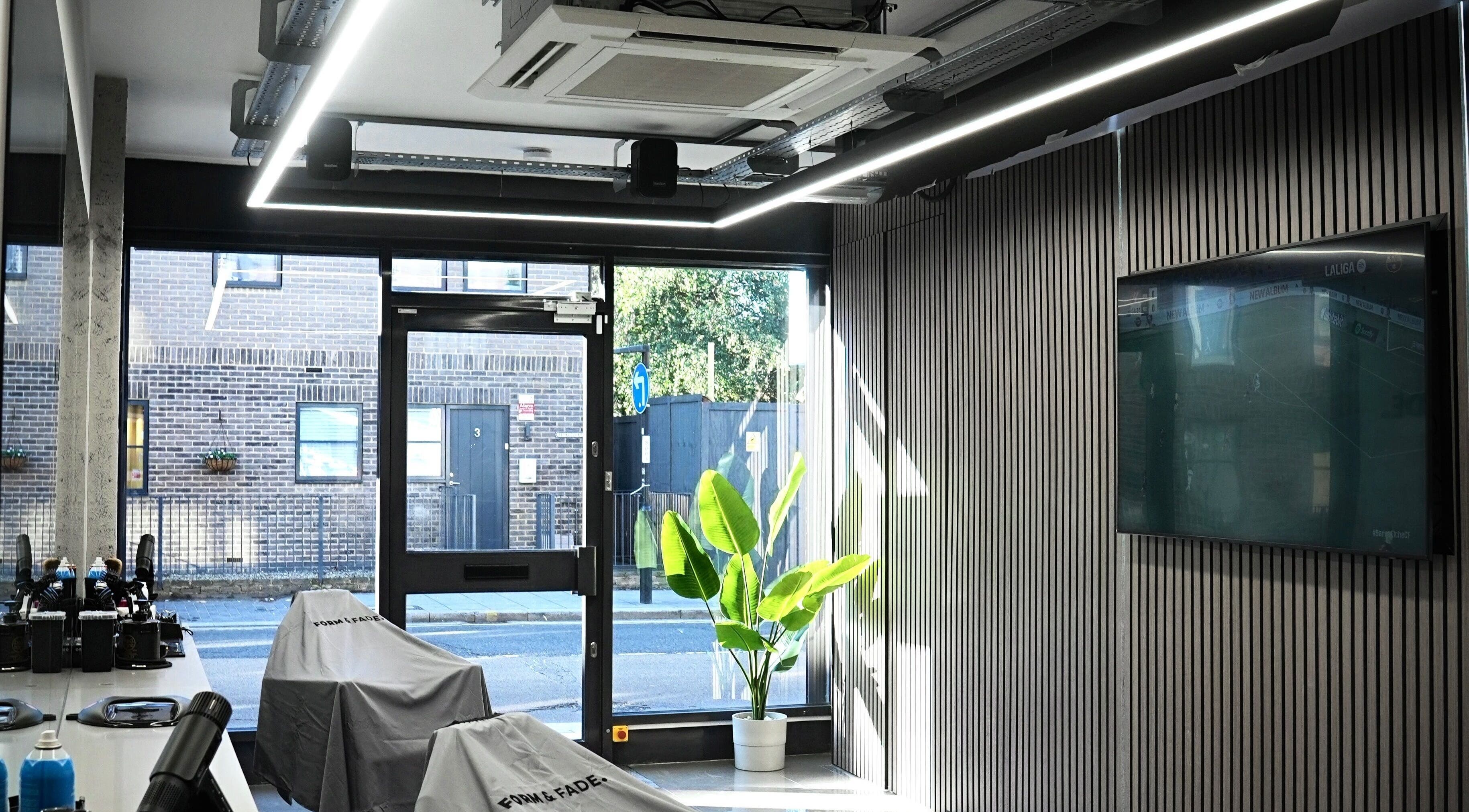 Sleek interior of Form & Fade, South Croydon, England, GB with natural light and stylish decor.