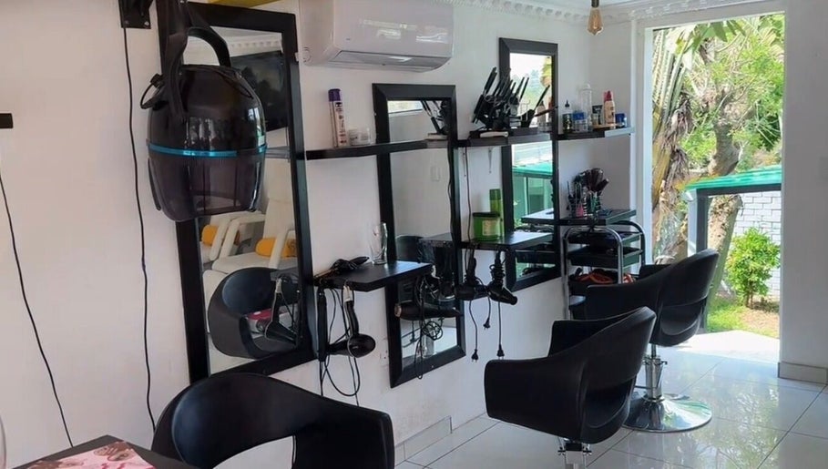Modern salon interior at Mellyz Beauty Studio, Randburg, Gauteng, ZA with contemporary decor and styling chairs.