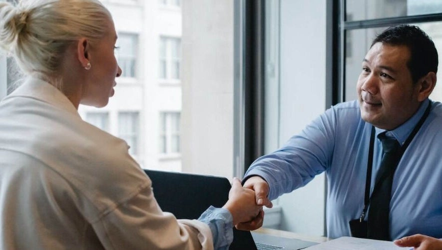 Two professionals shaking hands at Precision Driver Medicals- 83 Carver Street, Birmingham, England, GB.