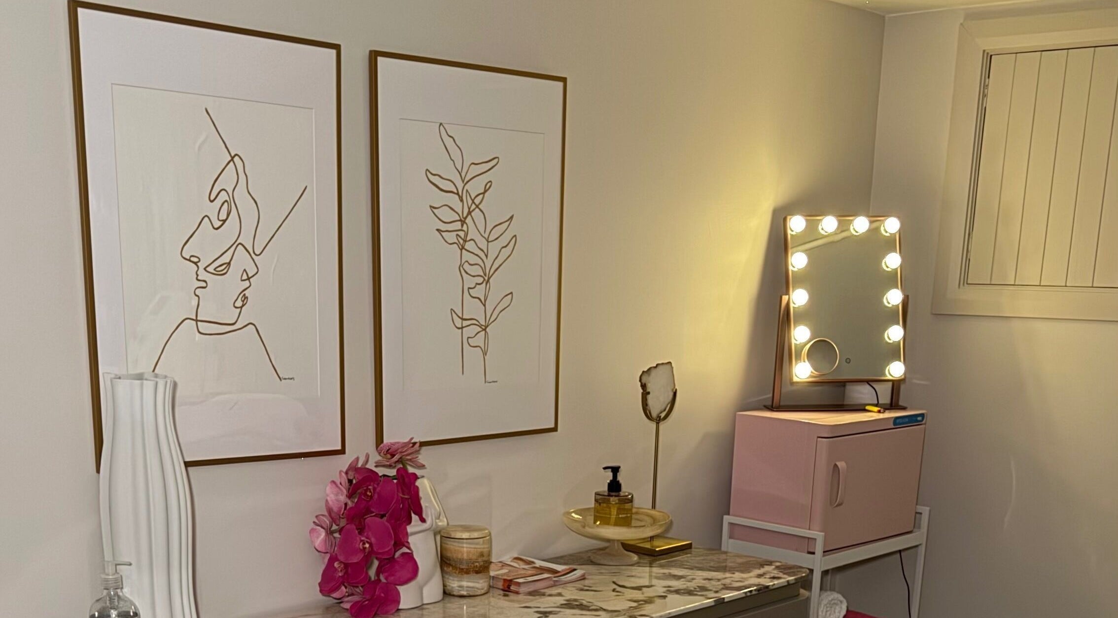 Elegant beauty room at Bespoke Silhouette, Birchgrove, NSW with unique art and illuminated mirror.