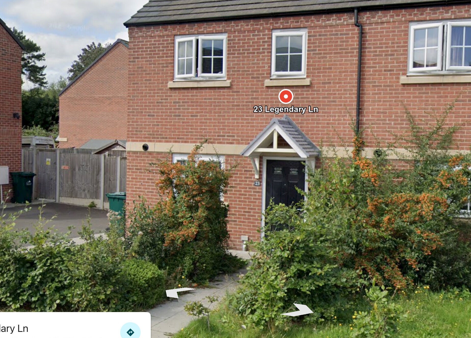 Front view of Nailed by Ells, a cozy beauty venue in Coventry, England, GB with lush greenery outside.