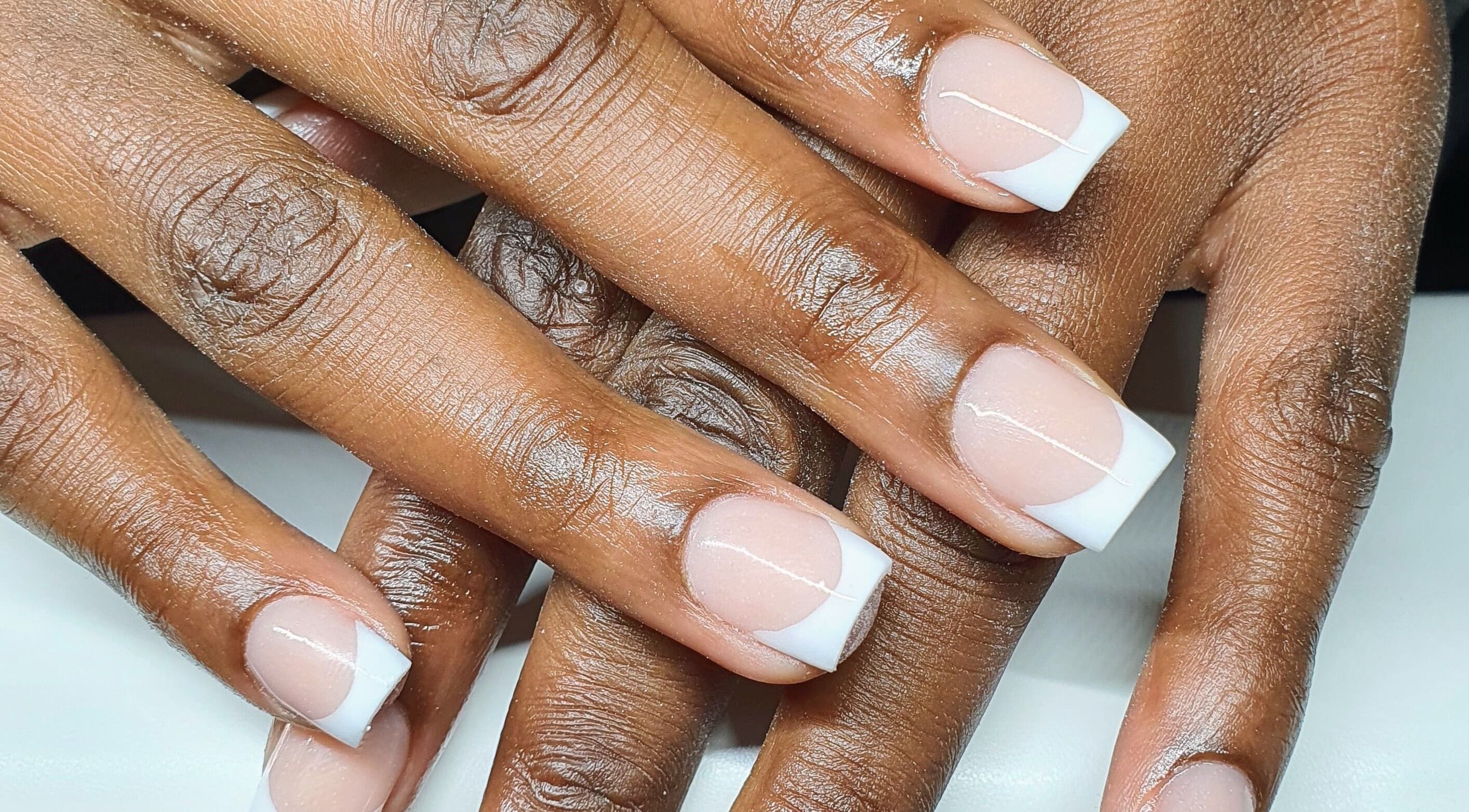 Elegant French manicure at Pink_Aura_Nails, Cape Town, Western Cape, ZA showcasing neat white tips on nails.