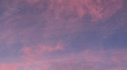 Calm pink and purple sky at Luna Healing, Newcastle upon Tyne, England, GB, offering tranquility and peace.