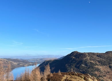 Stunning view near Luna Healing in Newcastle upon Tyne, England, GB, featuring hills and a serene lake.