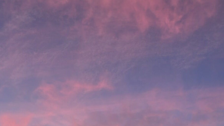 Dreamy pink and purple sky over Luna Healing, Newcastle upon Tyne, England, GB.