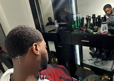 Client receives a stylish haircut at Theblazebarbershop, Kingston, St. Andrew Parish, JM.