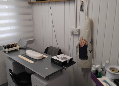 Cozy beauty station at Hairabelles, Bolton, England, GB, featuring manicure tools and a peaceful setting.