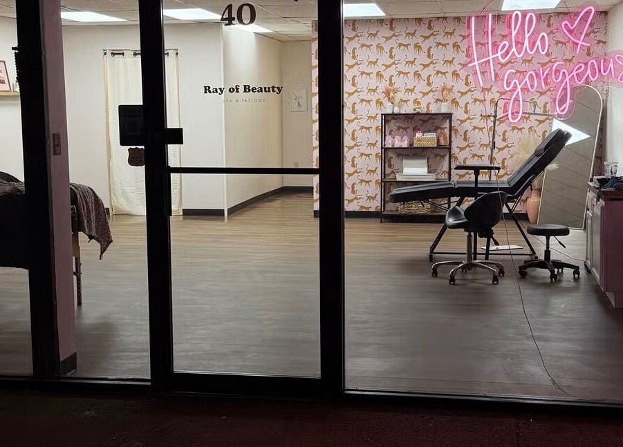 View of Esthetics by Abbi in Chillicothe, Ohio with 'Hello Gorgeous' neon sign and beauty station.