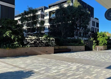 Entrance of Hydra Skin Spa Beauty in Leichhardt, New South Wales, AU, surrounded by lush greenery.