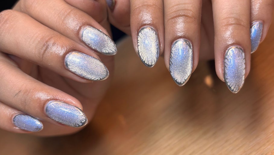 Shimmering metallic nails designed at Arcana Studio, Ciudad De México, Ciudad De México, MX offer chic style.