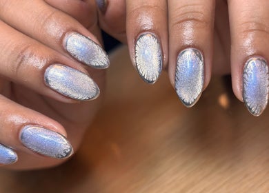 Shimmering metallic nails designed at Arcana Studio, Ciudad De México, Ciudad De México, MX offer chic style.