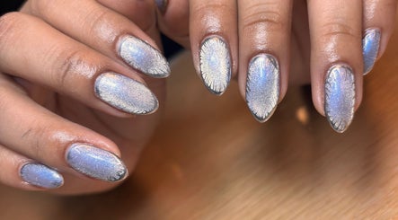 Shimmering metallic nails designed at Arcana Studio, Ciudad De México, Ciudad De México, MX offer chic style.