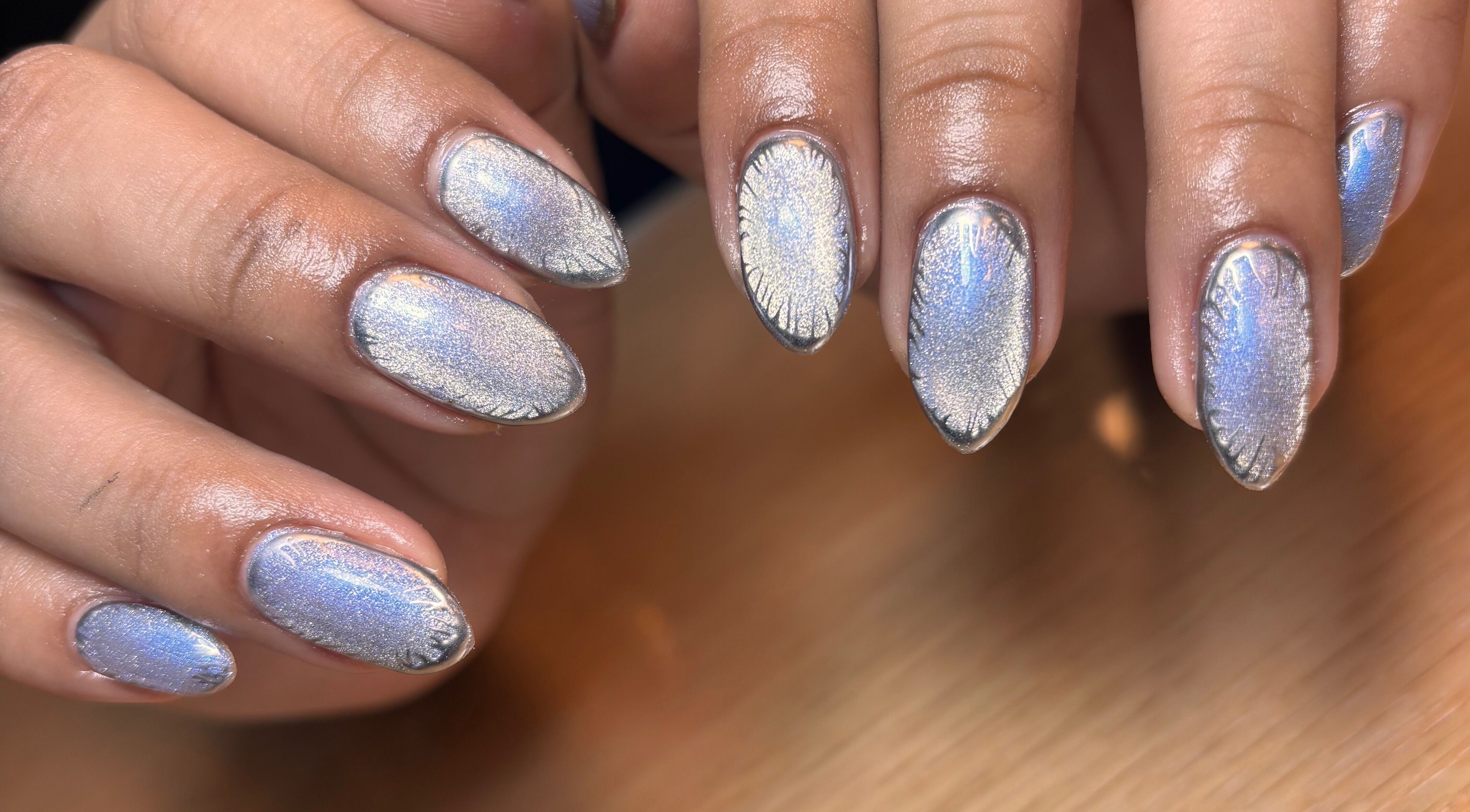 Shimmering metallic nails designed at Arcana Studio, Ciudad De México, Ciudad De México, MX offer chic style.