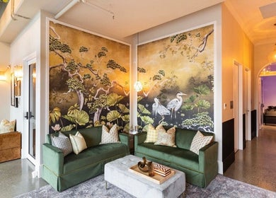 Elegant lounge in Bonded- Hair by Tess, Melbourne, Victoria, AU featuring artistic decor and plush seating.