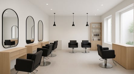 Modern salon interior at RawLockerz in Fort Lauderdale, Florida, US, featuring sleek black chairs and mirrors.
