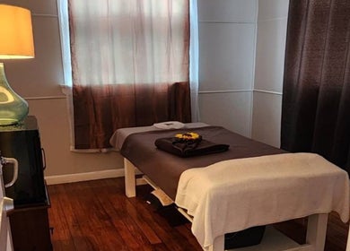 Tranquil massage room at Thai Massage By Alice, Gisborne, Gisborne Region, NZ with a cozy bed and soft lighting.