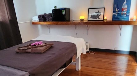 Relaxing massage room at Thai Massage By Alice in Gisborne, Gisborne Region, NZ, with cozy decor and soft lighting.