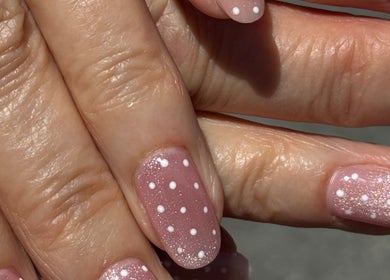 Stylish pink nails with white dots at The Lune Nails, Perth, Western Australia, AU. Perfect manicure style.