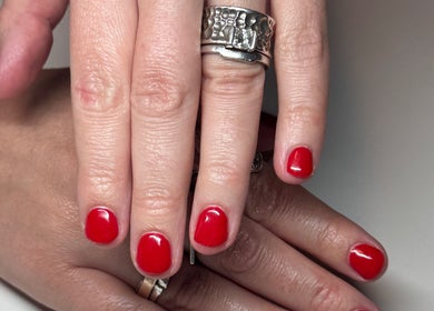 Vibrant red manicure at The Lune Nails, Perth, Western Australia, AU, showcasing stylish nail art.