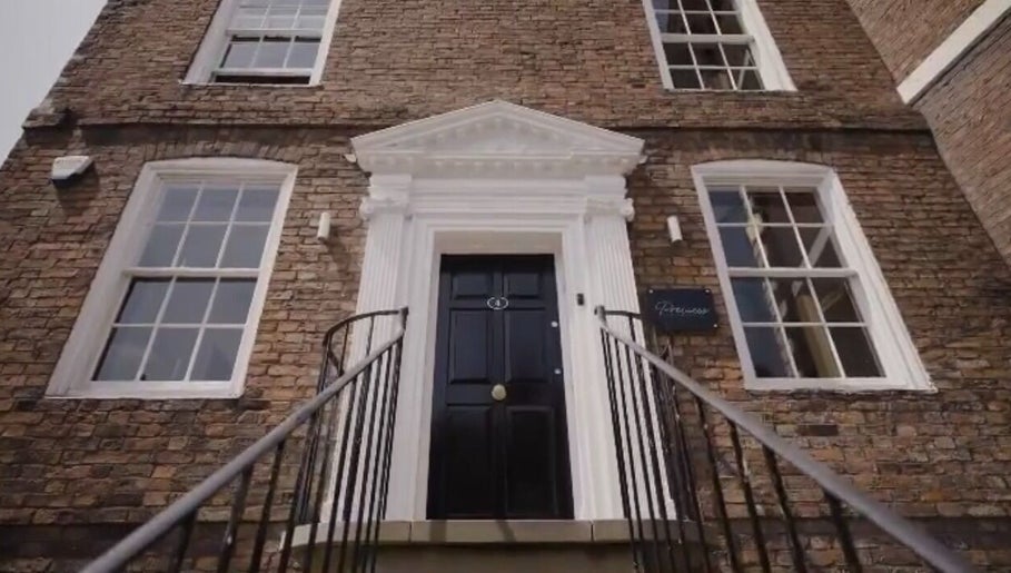 Entrance of Abigail Louise Aesthetics in Chester, England, GB, showcasing its elegant brick facade.