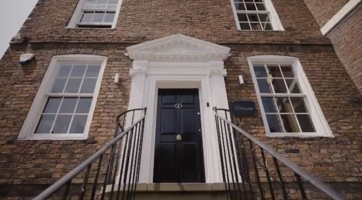 Entrance of Abigail Louise Aesthetics in Chester, England, GB, showcasing its elegant brick facade.